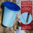 three gallon blue maple tapping bucket with lid hanging on a maple tree in winter. Insert shows extras including a thermometer and a drill bit. Caption reads: 3 three-gallon buckets with integrated lids. Keeps sap clean, covered, and secure on the tree.